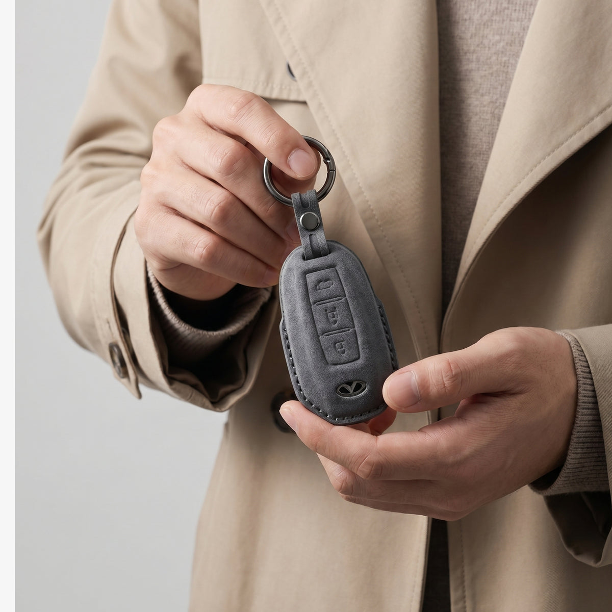 Infiniti Model A Alcantara key cover in Space Grey, in hand