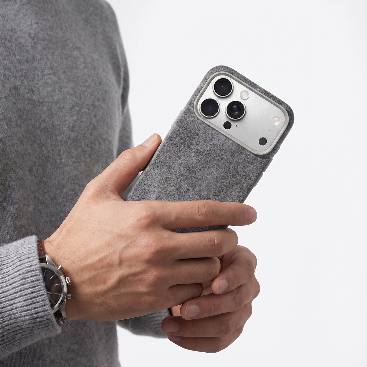 Nardo Gray Alcantara case for iPhone 18 Pro Max held in hands
